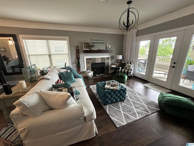 475 River Forest Ln Unit 1250, Talladega, AL 35160 - living area featuring a healthy amount of sunlight, a tiled fireplace, an inviting chandelier, and wood finished floors