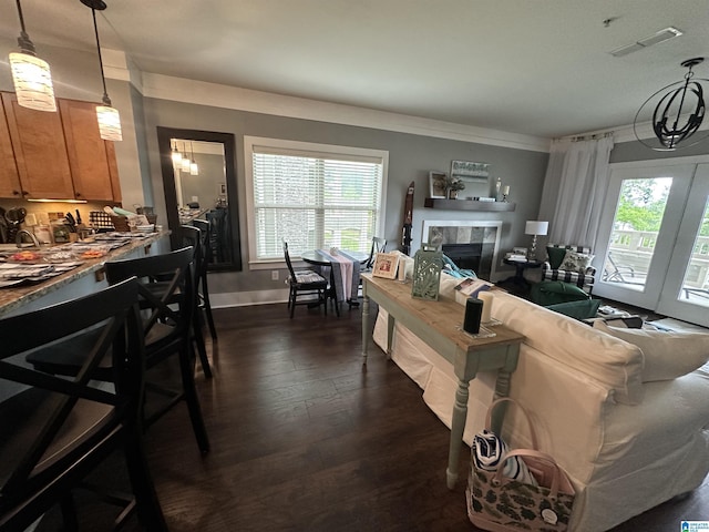 475 River Forest Ln Unit 1250, Talladega, AL 35160 - living area featuring dark wood-style flooring, visible vents, a tiled fireplace, and a wealth of natural light