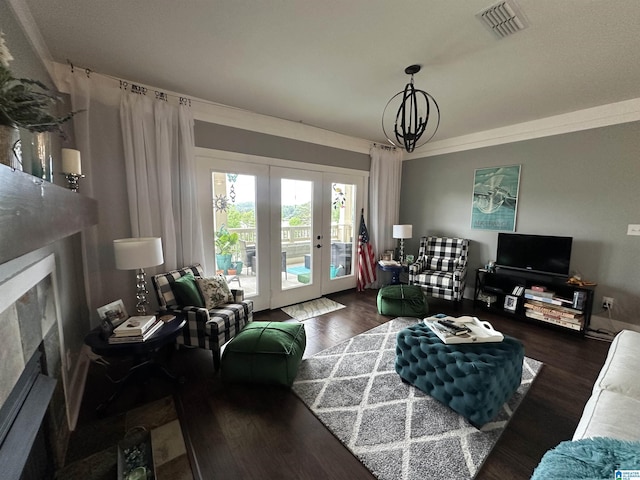 475 River Forest Ln Unit 1250, Talladega, AL 35160 - living room featuring french doors, visible vents, a fireplace, wood finished floors, and an inviting chandelier