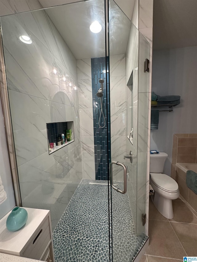 475 River Forest Ln Unit 1250, Talladega, AL 35160 - bathroom with tile patterned flooring, toilet, and a shower stall