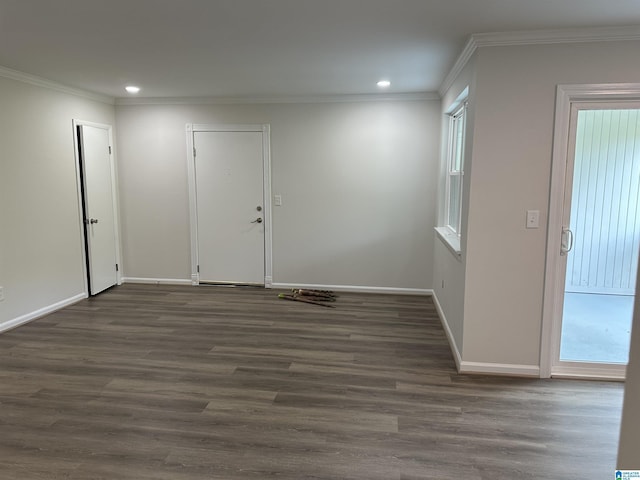 foyer entrance featuring crown molding, recessed lighting, dark wood finished floors, and baseboards