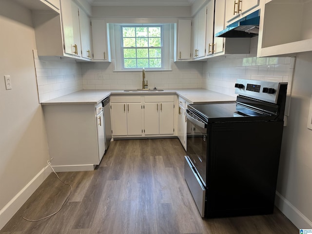 kitchen featuring electric range, baseboards, dark wood-style floors, under cabinet range hood, and a sink