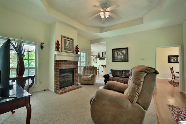 50 County Road 4311, Wedowee, AL 36278 - living area featuring baseboards, ceiling fan, a raised ceiling, and a wealth of natural light