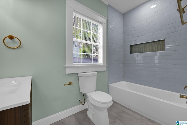 829 1st St SW, Birmingham, AL 35211 - bathroom featuring baseboards, toilet, vanity, tile patterned flooring, and shower / washtub combination