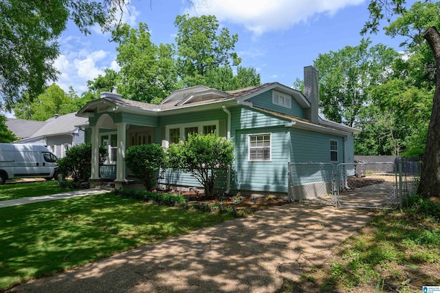 829 1st St SW, Birmingham, AL 35211 - view of front of home with a chimney and covered porch