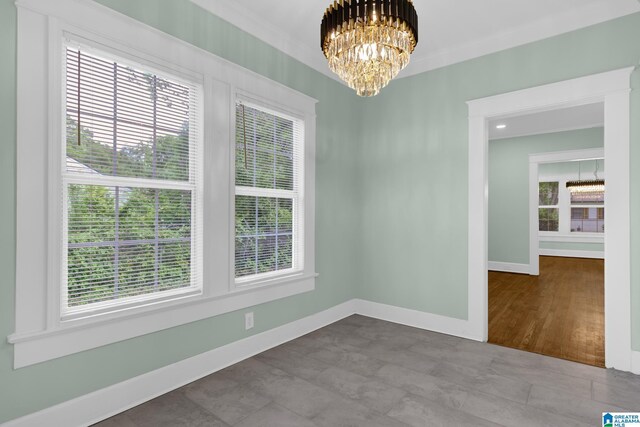 829 1st St SW, Birmingham, AL 35211 - unfurnished dining area with a chandelier and baseboards