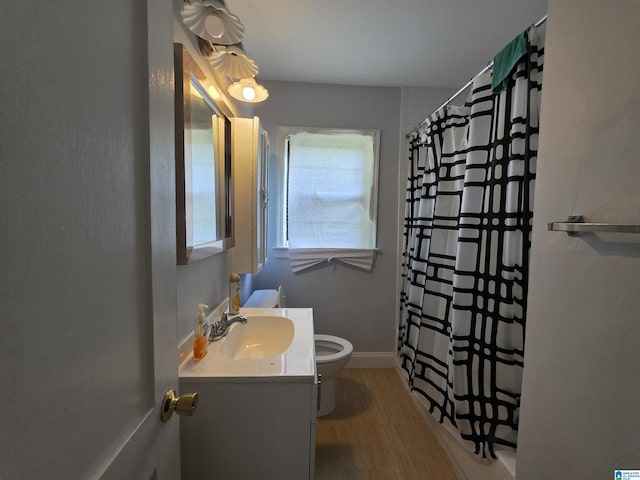 full bathroom with vanity, a shower with curtain, toilet, and wood finished floors