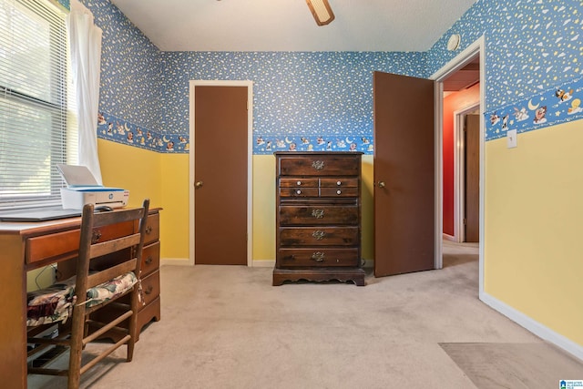 carpeted bedroom with wallpapered walls and baseboards
