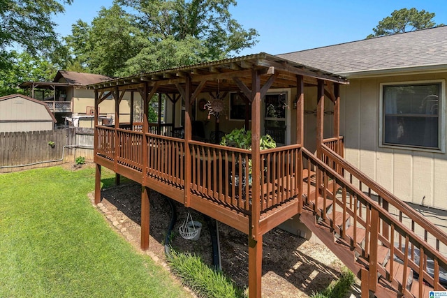 deck with fence and a yard