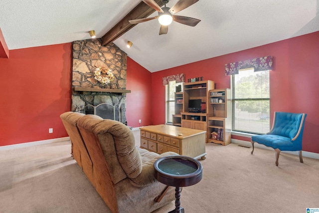 living room featuring a ceiling fan, a textured ceiling, baseboards, vaulted ceiling with beams, and light carpet