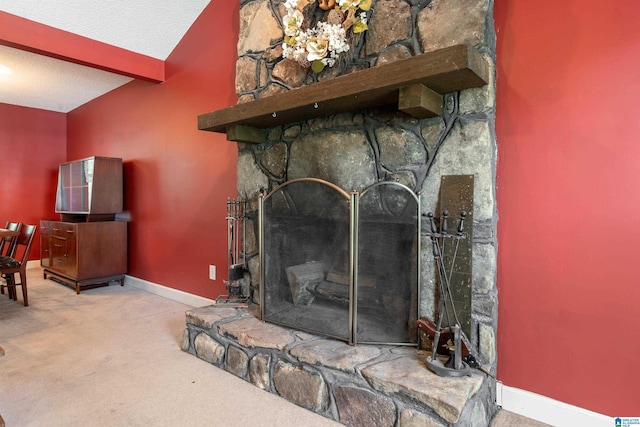 interior details featuring baseboards, carpet, a textured ceiling, and beam ceiling