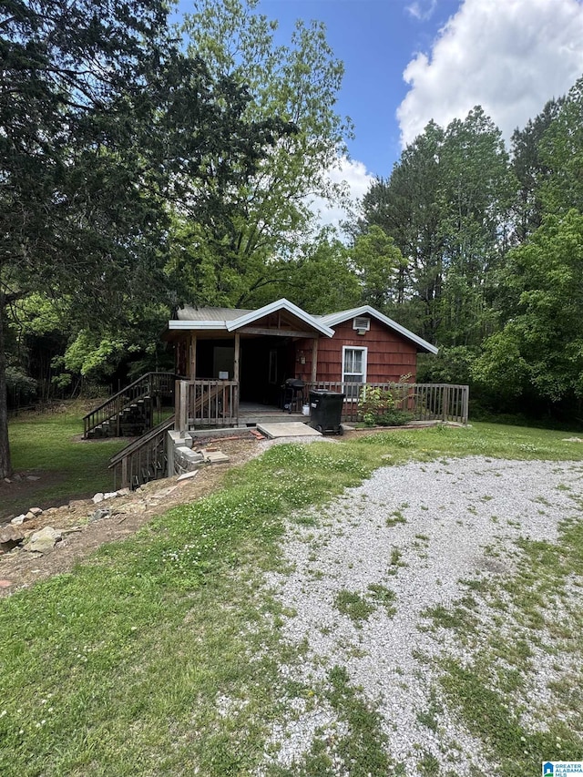 exterior space with a porch and a yard