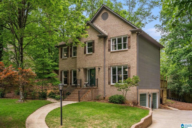 3012 Raven Cir, Hoover, AL 35244 - view of front facade featuring brick siding, a garage, and a front lawn