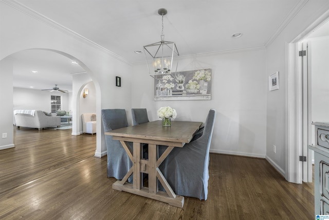 1856 Southwood Rd, Vestavia Hills, AL 35216 - dining area featuring baseboards, arched walkways, ceiling fan with notable chandelier, and wood finished floors