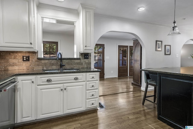 1856 Southwood Rd, Vestavia Hills, AL 35216 - kitchen featuring a sink, arched walkways, white cabinets, and dark wood-style floors