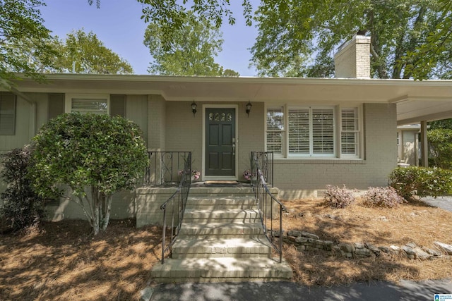 1856 Southwood Rd, Vestavia Hills, AL 35216 - view of front facade featuring brick siding and a chimney