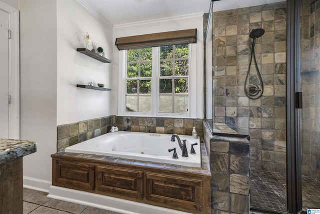 1856 Southwood Rd, Vestavia Hills, AL 35216 - bathroom featuring tile patterned floors, a jetted tub, baseboards, ornamental molding, and a stall shower