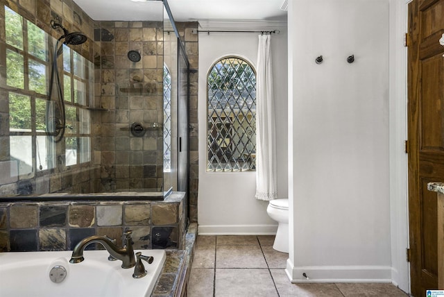1856 Southwood Rd, Vestavia Hills, AL 35216 - full bath with a garden tub, toilet, baseboards, tile patterned floors, and a tile shower