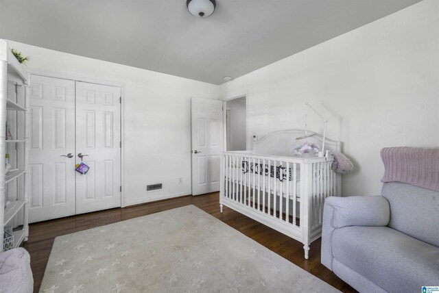 1856 Southwood Rd, Vestavia Hills, AL 35216 - bedroom with a closet, wood finished floors, and visible vents