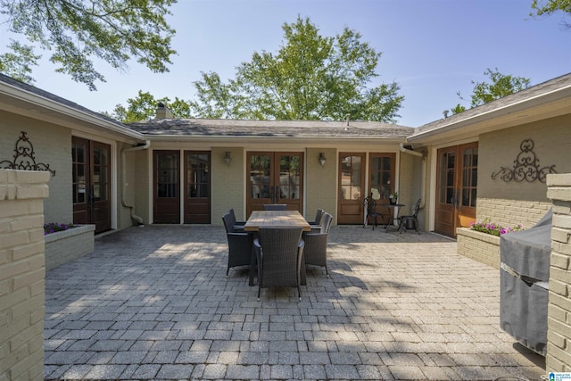 1856 Southwood Rd, Vestavia Hills, AL 35216 - view of patio / terrace featuring french doors and outdoor dining space