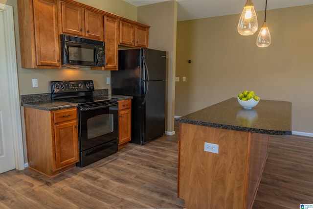 kitchen with brown cabinets, black appliances, and dark wood-type flooring