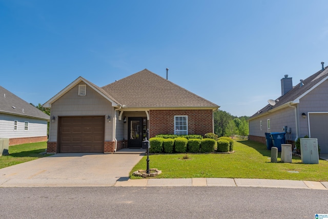 view of front of home featuring roof with shingles, a front yard, a garage, brick siding, and concrete driveway