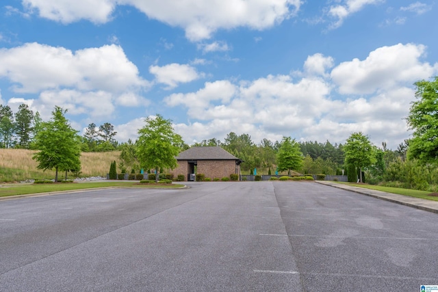view of street with sidewalks and curbs