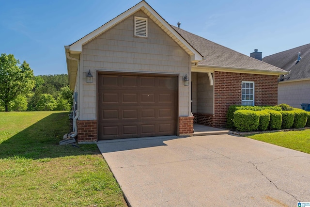 view of front of property featuring driveway, a chimney, a front yard, a garage, and brick siding