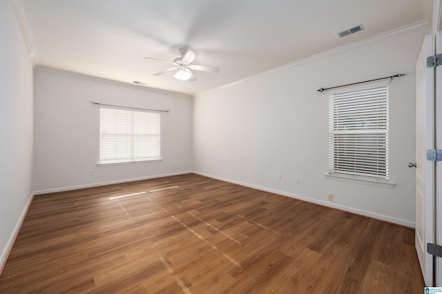 unfurnished room featuring baseboards, a ceiling fan, wood finished floors, and ornamental molding