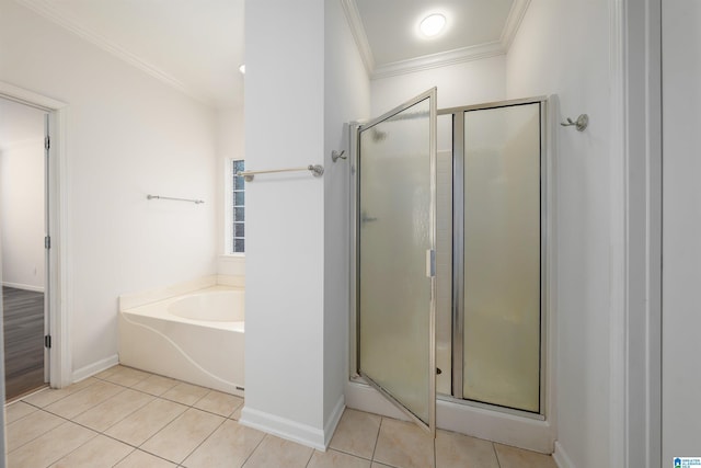 bathroom featuring crown molding, tile patterned flooring, and a shower stall
