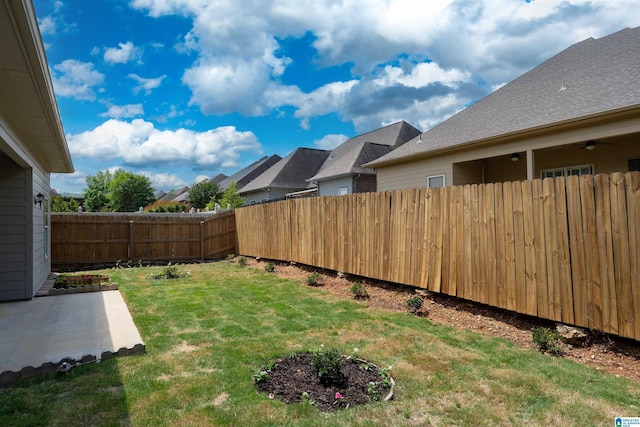 view of yard with a fenced backyard and a patio area