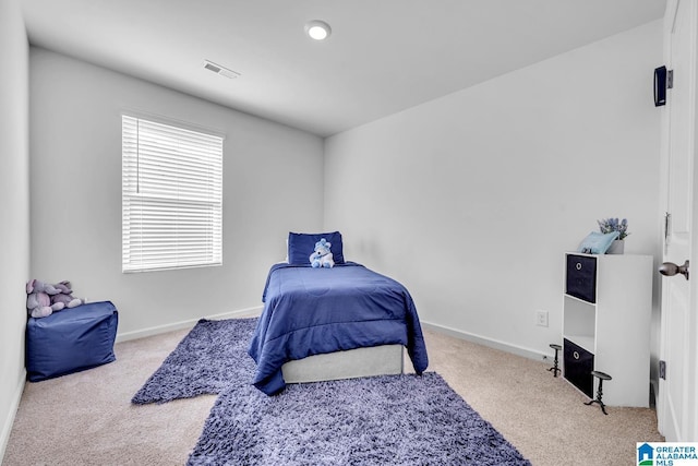 bedroom featuring carpet floors, baseboards, and visible vents