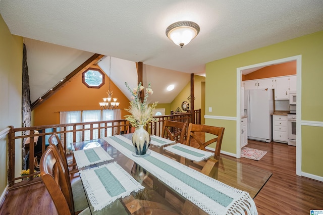 dining area featuring an inviting chandelier, baseboards, and wood finished floors