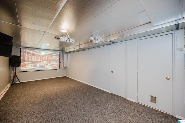 basement with carpet flooring and baseboards