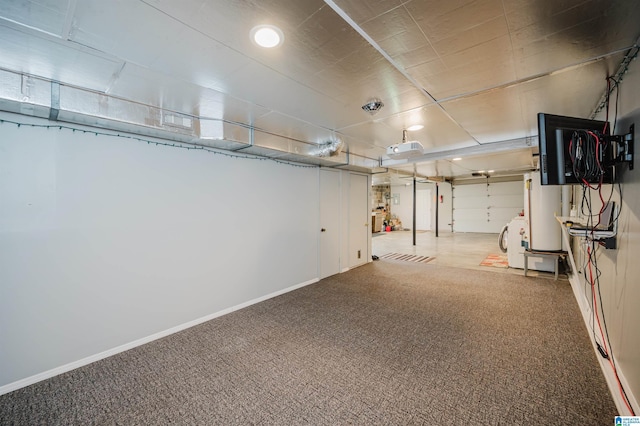 garage with baseboards and washer / clothes dryer