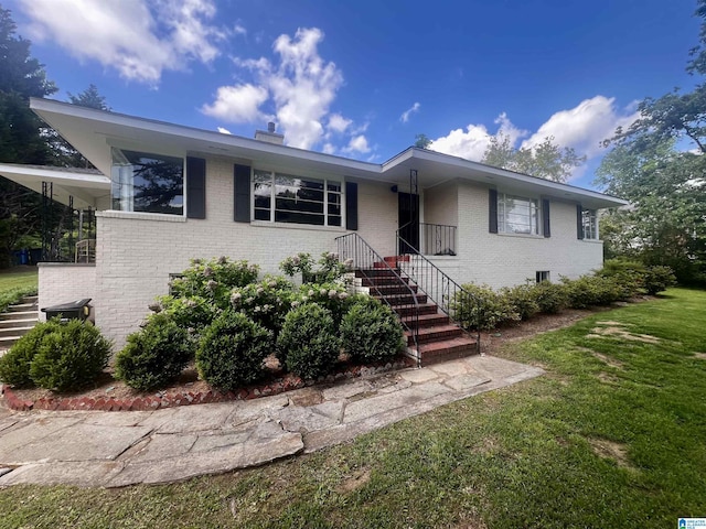 708 Devon Dr, Birmingham, AL 35209 - view of front of home with brick siding, stairs, and a front yard