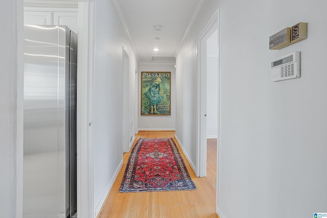 708 Devon Dr, Birmingham, AL 35209 - hall with ornamental molding, light wood finished floors, and baseboards