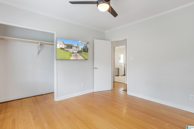 708 Devon Dr, Birmingham, AL 35209 - unfurnished bedroom with light wood-style floors, crown molding, a closet, baseboards, and a ceiling fan