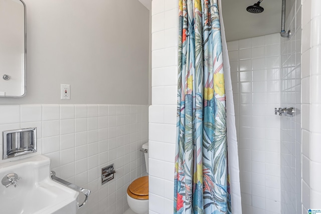 708 Devon Dr, Birmingham, AL 35209 - full bathroom with tile walls, a tile shower, and toilet