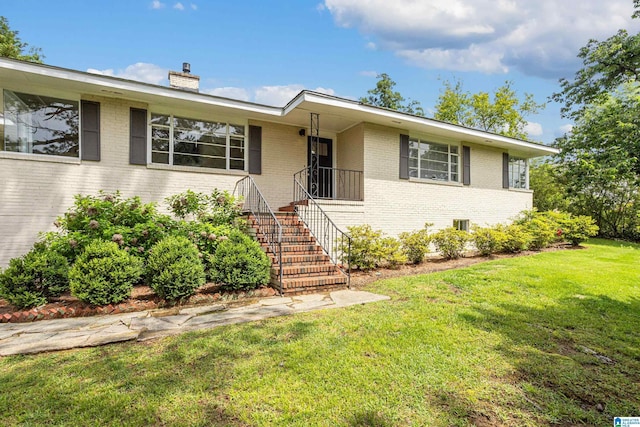 708 Devon Dr, Birmingham, AL 35209 - ranch-style home with brick siding, a chimney, and a front yard