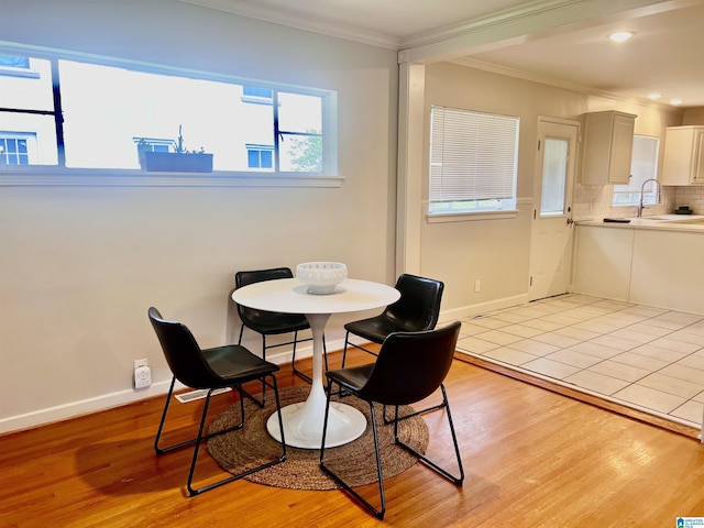 708 Devon Dr, Birmingham, AL 35209 - dining room with ornamental molding, light wood-style flooring, baseboards, and recessed lighting
