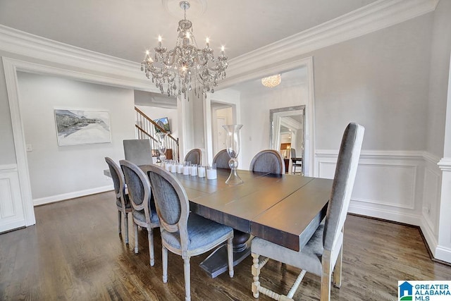 dining space featuring crown molding, stairway, wood finished floors, and a chandelier