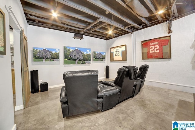 cinema featuring baseboards and concrete floors