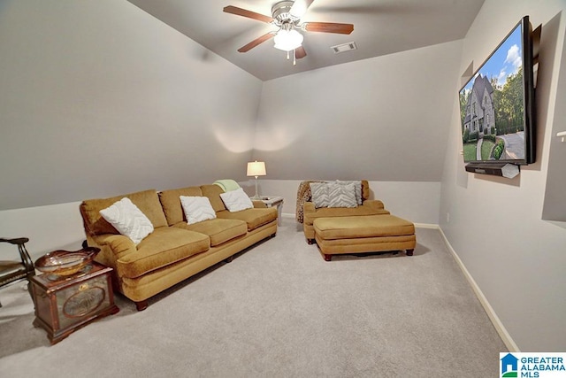 living area with a ceiling fan, visible vents, vaulted ceiling, carpet floors, and baseboards