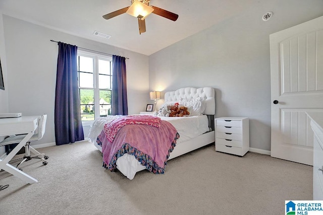 carpeted bedroom with baseboards, ceiling fan, and visible vents