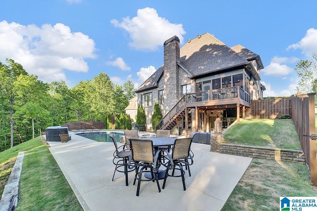 view of patio featuring stairway, a deck, a fenced in pool, and a fenced backyard