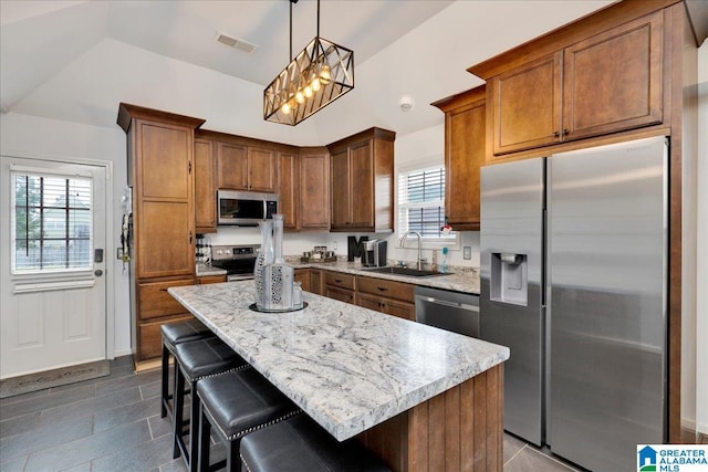 kitchen with a sink, appliances with stainless steel finishes, plenty of natural light, and visible vents