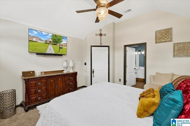 carpeted bedroom with ensuite bath, a ceiling fan, baseboards, vaulted ceiling, and visible vents