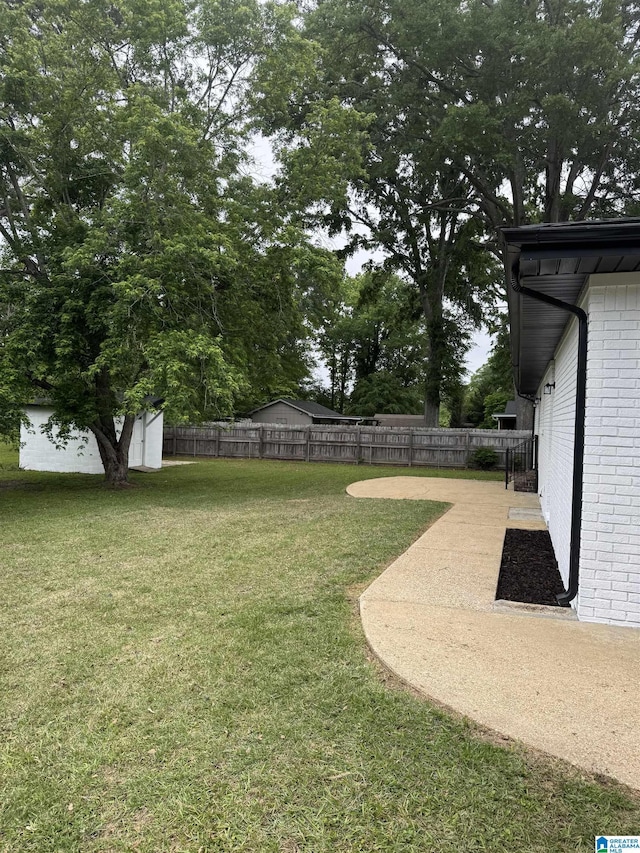 view of yard with a fenced backyard