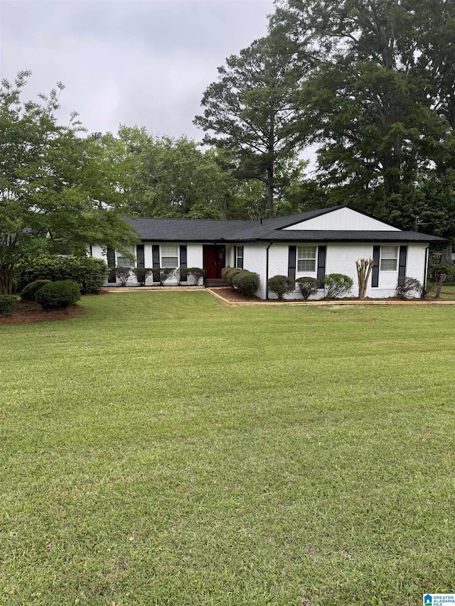 ranch-style house with a front lawn